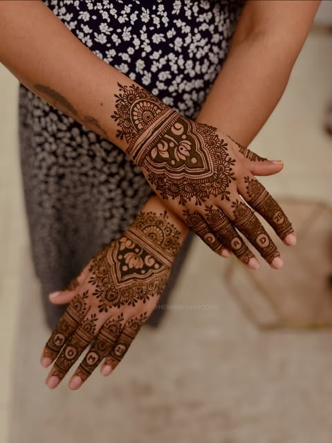Bridal mehndi across the backs of both hands and fingers